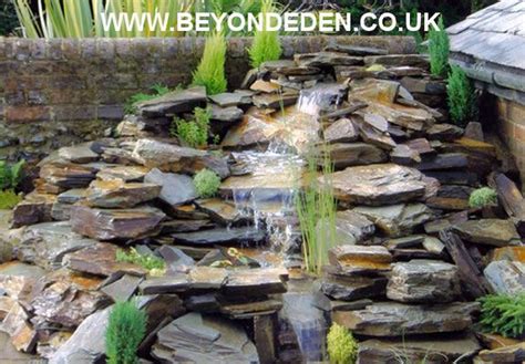 Water feature with heather on rockery | Rockery garden, Water features ...