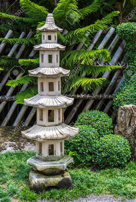 Japanese Pagoda Stone In The Tropical Garden Stock Photo, Picture And ...