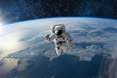 Premium Photo | Astronaut in outer open space over the planet Earth ...