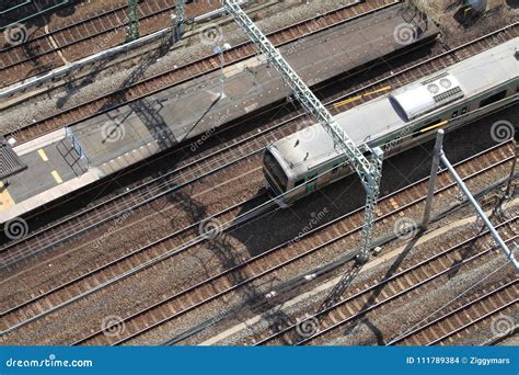 Train Running through Station in Japan Stock Photo - Image of track ...