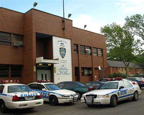 several police cars parked in front of a building