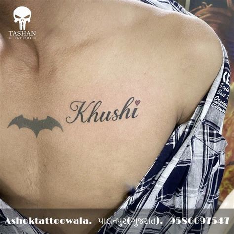 a man with a bat tattoo on his chest that says, khushi