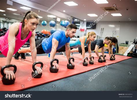 Fit People Working Out In Fitness Class At The Gym Stock Photo ...