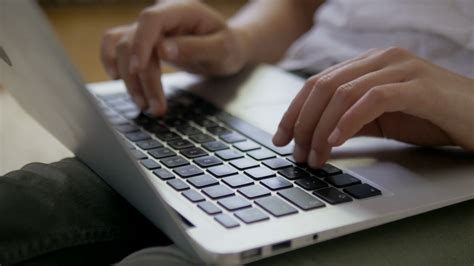 Close-up of female hands typing on the laptop keyboard. Stock Video ...