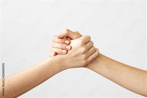 Two hands holding each other strongly Stock Photo | Adobe Stock