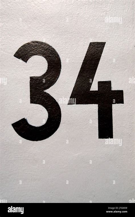 The number 34 on a wall Stock Photo - Alamy