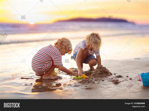 Kids Playing On Beach Image & Photo (Free Trial) | Bigstock