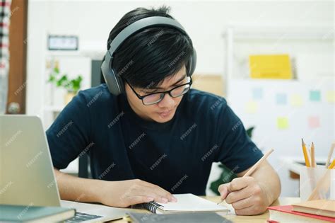 Premium Photo | Young man study in front of the laptop computer at home