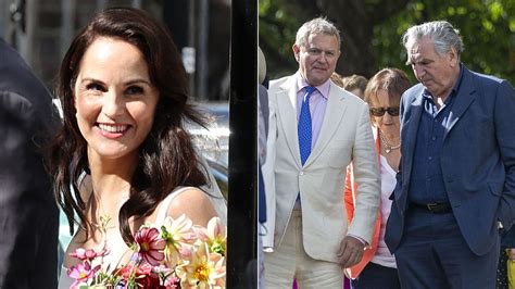 Hugh Bonneville looks proud as on-screen daughter Michelle Dockery ties ...