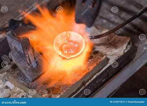 Melting Process of Precious Metal Gold Behind a Jeweler`s Workbench ...