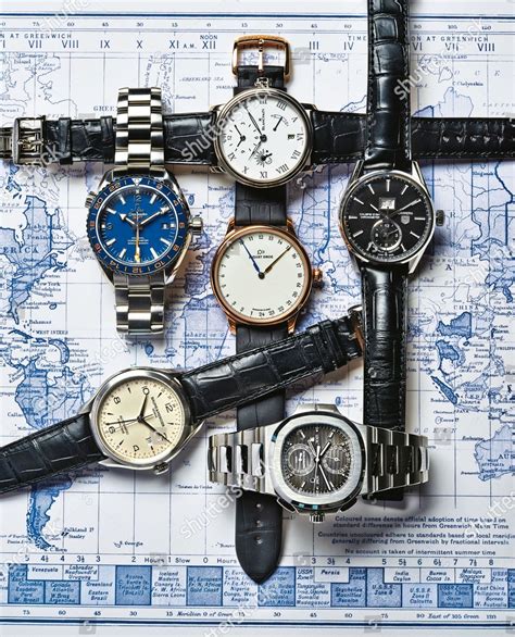 Luxury Mens Timepieces Arranged On World Editorial Stock Photo - Stock ...