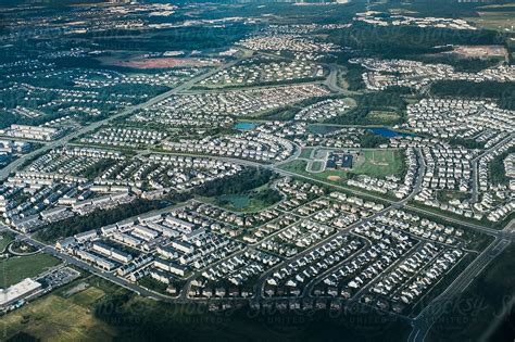 "Aerial View Of Suburban Housing" by Stocksy Contributor "Juno" - Stocksy