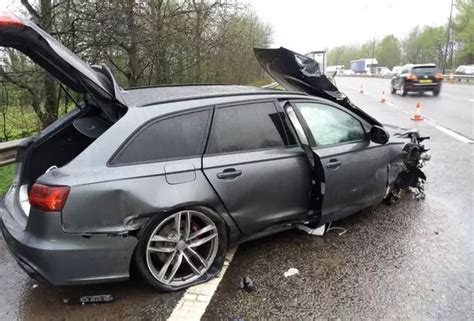 Audi RS ripped apart after smashing into motorway central reservation ...