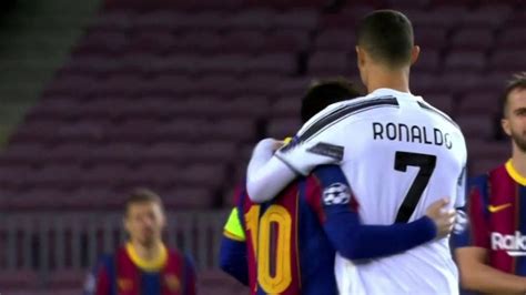 Messi and Ronaldo hug each other before the game