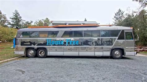 Old Charter Bus Reborn As Stunning Wood-Infused RV With Roof Deck