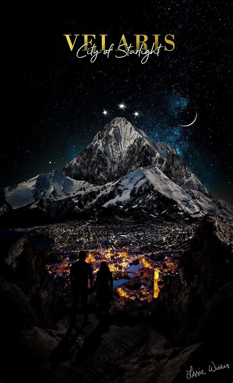 two people standing in front of a mountain at night