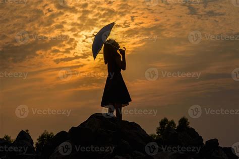 Silhouette sad girl at sunset. 13310638 Stock Photo at Vecteezy