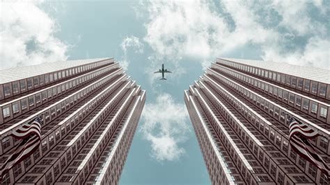 Worm's-eye view Photo of Plane Between Two High-rise Buildings · Free ...