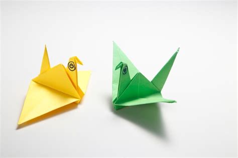 Premium Photo | Origami bird crane against a white background