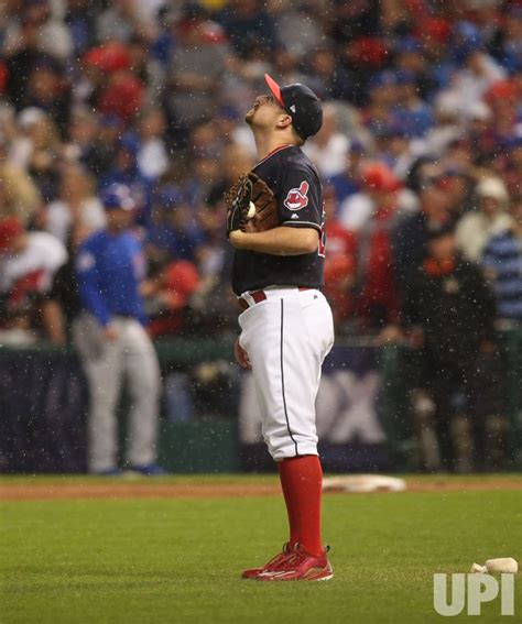 Photo: Indians pitcher Bryan Shaw looks at rain that caused delay in ...