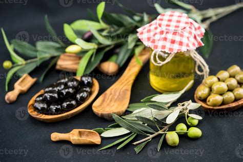 cold pressed olive oil with branch and fruits 3816430 Stock Photo at ...