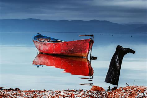 Orange Row Boat on Body of Water · Free Stock Photo