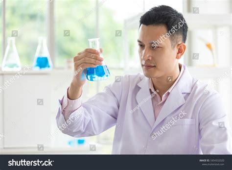 Young Man Scientist Holding Looking Science Stock Photo 1854332020 ...