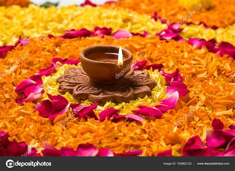 Flower rangoli for Diwali or pongal made using marigold or zendu ...