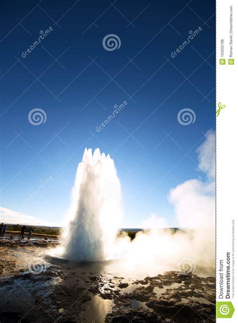 Strokkur Geysir Eruption Against the Sun, Iceland Stock Photo - Image ...