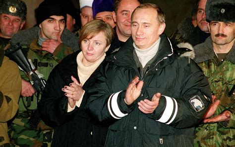 Vladimir Putin and his wife Lyudmila applaud during a concert after an ...