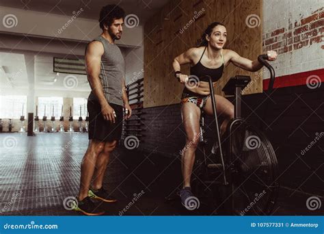 Female Doing Cardio Workout at Gym with Trainer Stock Image - Image of ...