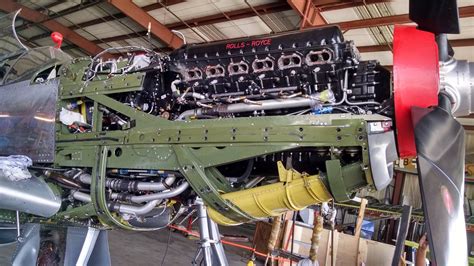 an airplane engine sitting inside of a hangar