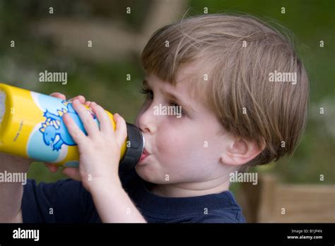 little boy drinking from water bottle Stock Photo - Alamy