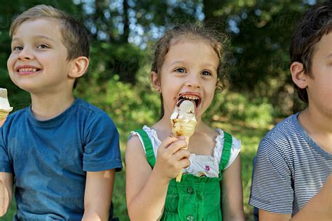 Children Eating Ice Cream. by Dejan Ristovski