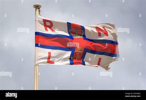 A general view of an RNLI flag at Skegness beach as rain, wind and ...