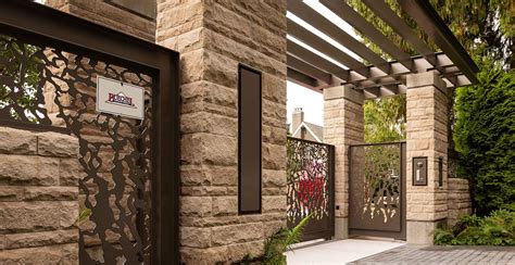 Modern exterior veneer stone home driveway gate design Rustic Buff ...