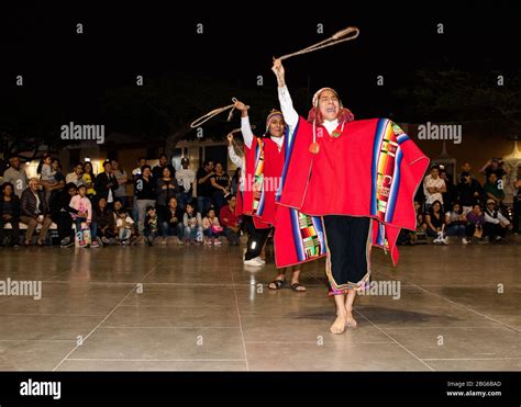 Dancers in colourful costumes performing traditional Huayno Cusqueño ...