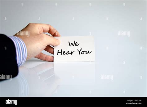 We hear you text concept isolated over white background Stock Photo - Alamy