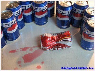 a table topped with lots of soda cans and candy bars