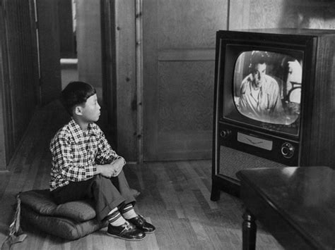 Family Watching Old Television