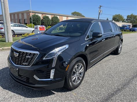 2024 CADILLAC RAISED ROOF SIX DOOR FUNERAL LIMOUSINE - Specialty Hearse