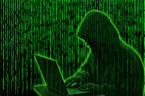 Conceptual image of a hacker on green matrix background » Fischblog ...