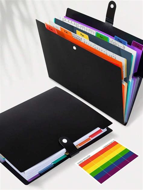 a binder with several folders in it and a color guide on the side