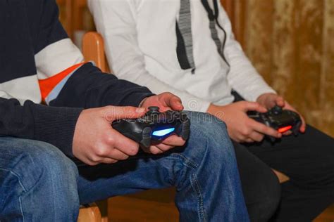 Boys are Playing Sony PlayStation. Boy Playing with a Joystick. a Boy ...