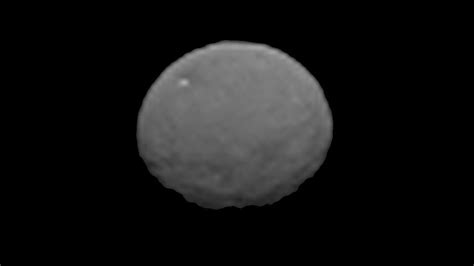 Ceres: craters, structures and a bright spot