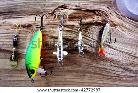 Still-life from baits for fishing on a tree - Stock Image - Everypixel