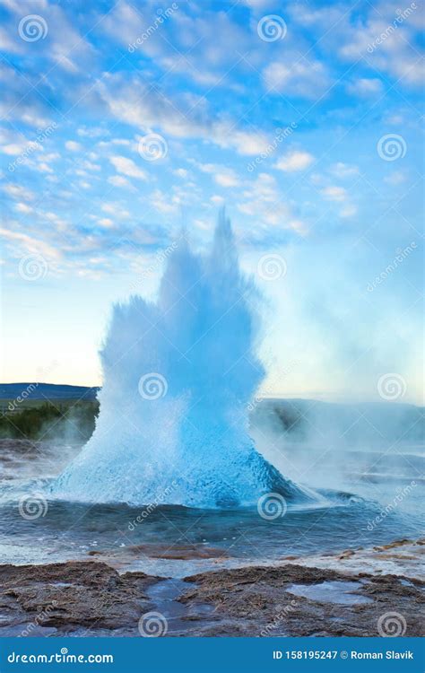 Strokkur Geysir Eruption with Bright Blue Sky, Iceland Stock Image ...