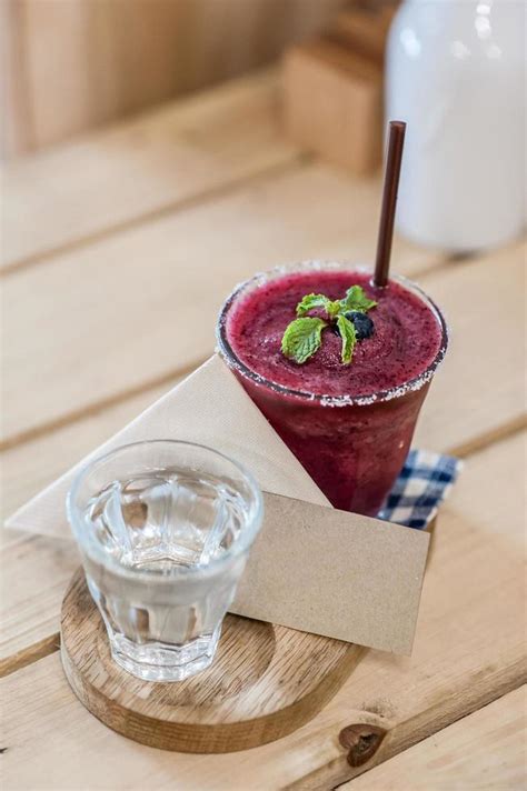 Blueberry smoothie on wooden background 11899802 Stock Photo at Vecteezy