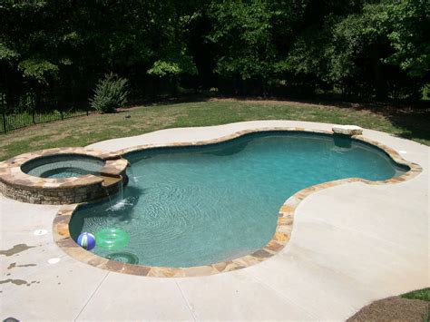 Swimming pool designs with hot tub | Hawk Haven