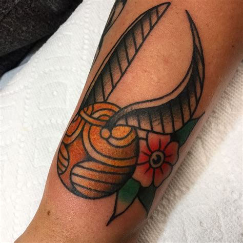 willandrew:golden-snitch-traditional-tattoo